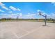 Community basketball court surrounded by residential homes and green spaces at 26385 E Canal Pl, Aurora, CO 80018