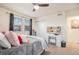 Bedroom featuring a modern ceiling fan, closet, and vanity area at 26385 E Canal Pl, Aurora, CO 80018