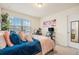 Cozy bedroom with a view and a well-organized workspace at 26385 E Canal Pl, Aurora, CO 80018