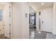 Inviting entryway featuring wood floors and a stylish front door at 26385 E Canal Pl, Aurora, CO 80018