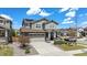 Beautiful two-story home with a well-maintained lawn, solar panels, and two-car garage at 26385 E Canal Pl, Aurora, CO 80018