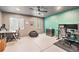 Spacious home office featuring dual workstations, a ceiling fan and a comfortable beanbag chair at 26385 E Canal Pl, Aurora, CO 80018