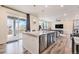 Bright kitchen featuring granite countertops, stainless steel appliances, wood floors and a sliding glass door at 26385 E Canal Pl, Aurora, CO 80018