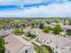 Features an aerial view of a residential area with scenic golf course views and a community atmosphere at 19481 E 50Th Pl, Denver, CO 80249