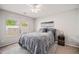 Comfortable bedroom with neutral tones, a soft rug, and natural light from the window at 19481 E 50Th Pl, Denver, CO 80249
