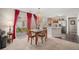 Bright dining area seamlessly connects to the kitchen and features a sliding glass door to the outdoor patio at 19481 E 50Th Pl, Denver, CO 80249