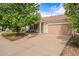 Well-maintained single-Gathering home featuring a cozy front porch, two-car garage, and inviting landscaping at 19481 E 50Th Pl, Denver, CO 80249