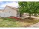 Charming single-Gathering home featuring a cozy front porch and meticulous landscaping at 19481 E 50Th Pl, Denver, CO 80249