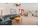 Open-concept living room and dining area features comfortable seating, natural light, and modern finishes at 19481 E 50Th Pl, Denver, CO 80249
