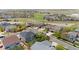 Aerial view of community with lush green spaces, mature trees, and sidewalks at 15915 E Summit Fox Ave, Parker, CO 80134