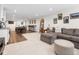 Spacious finished basement featuring a comfortable seating area, wet bar, and entertainment space at 15915 E Summit Fox Ave, Parker, CO 80134