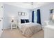 Bright bedroom with a neutral color palette, comfortable carpet, and a dedicated desk area at 15915 E Summit Fox Ave, Parker, CO 80134