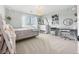 Charming bedroom with a bright color palette, neutral carpet, and ample natural light at 15915 E Summit Fox Ave, Parker, CO 80134