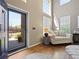 Bright entryway with soaring ceilings, hardwood floors, and a large window allowing for plenty of natural light at 15915 E Summit Fox Ave, Parker, CO 80134