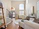 Bright and airy living room with high ceilings, hardwood floors, stylish decor, and elegant staircase at 15915 E Summit Fox Ave, Parker, CO 80134