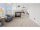Expansive main bedroom with a fireplace, seating area, ceiling fan, and en-suite bathroom at 15915 E Summit Fox Ave, Parker, CO 80134
