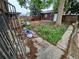 Backyard is fenced and has a storage shed, mature trees, and large grassy area at 1078 Elmira St, Aurora, CO 80010