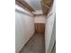 Walk-in closet features multiple rows of shelves and wooden accent paneling at 1078 Elmira St, Aurora, CO 80010