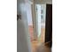 Hallway view with wood floors leading to a bathroom and bedroom at 1078 Elmira St, Aurora, CO 80010