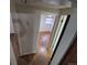 Hallway view leading to a bedroom featuring hardwood floors and natural light from a window at 1078 Elmira St, Aurora, CO 80010