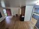 Open living room with hardwood floors, adjacent kitchen, and ample space for modern living at 1078 Elmira St, Aurora, CO 80010