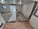 An empty room with carpet and tile flooring, featuring neutral walls at 1078 Elmira St, Aurora, CO 80010