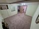 An empty room featuring light walls and carpet flooring with air conditioning at 1078 Elmira St, Aurora, CO 80010