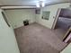 An empty room featuring light walls and carpet flooring with air conditioning at 1078 Elmira St, Aurora, CO 80010
