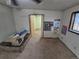 An empty room featuring light walls, carpet flooring, and a window at 1078 Elmira St, Aurora, CO 80010