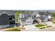 Aerial shot of the home showcasing a modern architectural style, landscaping, and neighborhood at 2141 Fountain Cir, Erie, CO 80516