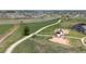 Real estate aerial view showcasing a playground, park, and walking paths within the community at 2141 Fountain Cir, Erie, CO 80516