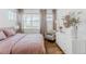 Serene bedroom featuring a comfortable bed, stylish decor, ample natural light, and a cozy atmosphere for restful nights at 2141 Fountain Cir, Erie, CO 80516