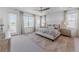 Bright bedroom with a large window, plush carpet, and stylish furniture at 2141 Fountain Cir, Erie, CO 80516