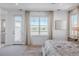 Bright bedroom with a balcony and a large window offering scenic views at 2141 Fountain Cir, Erie, CO 80516