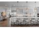 Bright, open kitchen with a large center island, stainless steel appliances, and ample seating at 2141 Fountain Cir, Erie, CO 80516