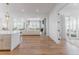 Open-concept layout showing the kitchen, living, and outdoor areas, designed for seamless entertaining and modern living at 2141 Fountain Cir, Erie, CO 80516