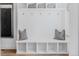 Organized mudroom with built-in storage, hooks, seating, and cubbies for efficient organization at 2141 Fountain Cir, Erie, CO 80516