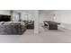 Spacious recreation room with cozy seating area, pool table, and ample space for entertainment at 2141 Fountain Cir, Erie, CO 80516