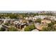 An aerial shot shows new modern homes nestled within mature trees, capturing the vibrant neighborhood at 1262 N Stuart St # 2, Denver, CO 80204
