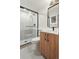 Modern bathroom with a glass enclosed shower and a wood grain vanity at 1262 N Stuart St # 2, Denver, CO 80204