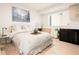 Bright bedroom with large bed, wood floors, and modern decor at 1262 N Stuart St # 2, Denver, CO 80204