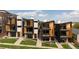 Aerial view of modern townhouses with balconies and contemporary design; surrounded by well-maintained green spaces at 1262 N Stuart St # 2, Denver, CO 80204