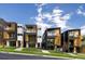 Modern townhomes showcase sleek architectural designs with balconies, wood accents, and well-manicured lawns at 1262 N Stuart St # 2, Denver, CO 80204