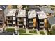 Striking modern townhouses boast a sleek design with balconies and wood accents at 1262 N Stuart St # 2, Denver, CO 80204