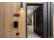 Front door view of the house, modern door, and wood siding at 1262 N Stuart St # 2, Denver, CO 80204