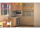 A compact kitchenette includes a microwave, small fridge, and cabinets, perfect for a small living space at 1262 N Stuart St # 2, Denver, CO 80204