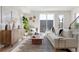 Sun-drenched living room with stylish furnishings and a large sliding glass door at 1262 N Stuart St # 2, Denver, CO 80204