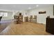 Finished basement with laminate wood flooring, a pub table set, and a view of the stairs at 3325 W 111Th Loop # C, Westminster, CO 80031