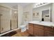 Bathroom with a glass enclosed shower, a single sink vanity, and wood-look flooring at 3325 W 111Th Loop # C, Westminster, CO 80031