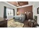 Comfortable bedroom with ceiling fan, wide windows, and a stylish, neutral color palette at 3325 W 111Th Loop # C, Westminster, CO 80031